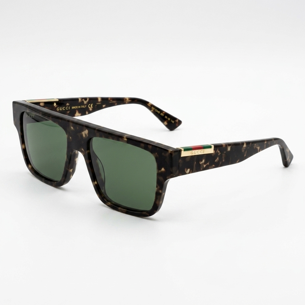 Sunglasses with tortoiseshell frame and green lenses on a white background